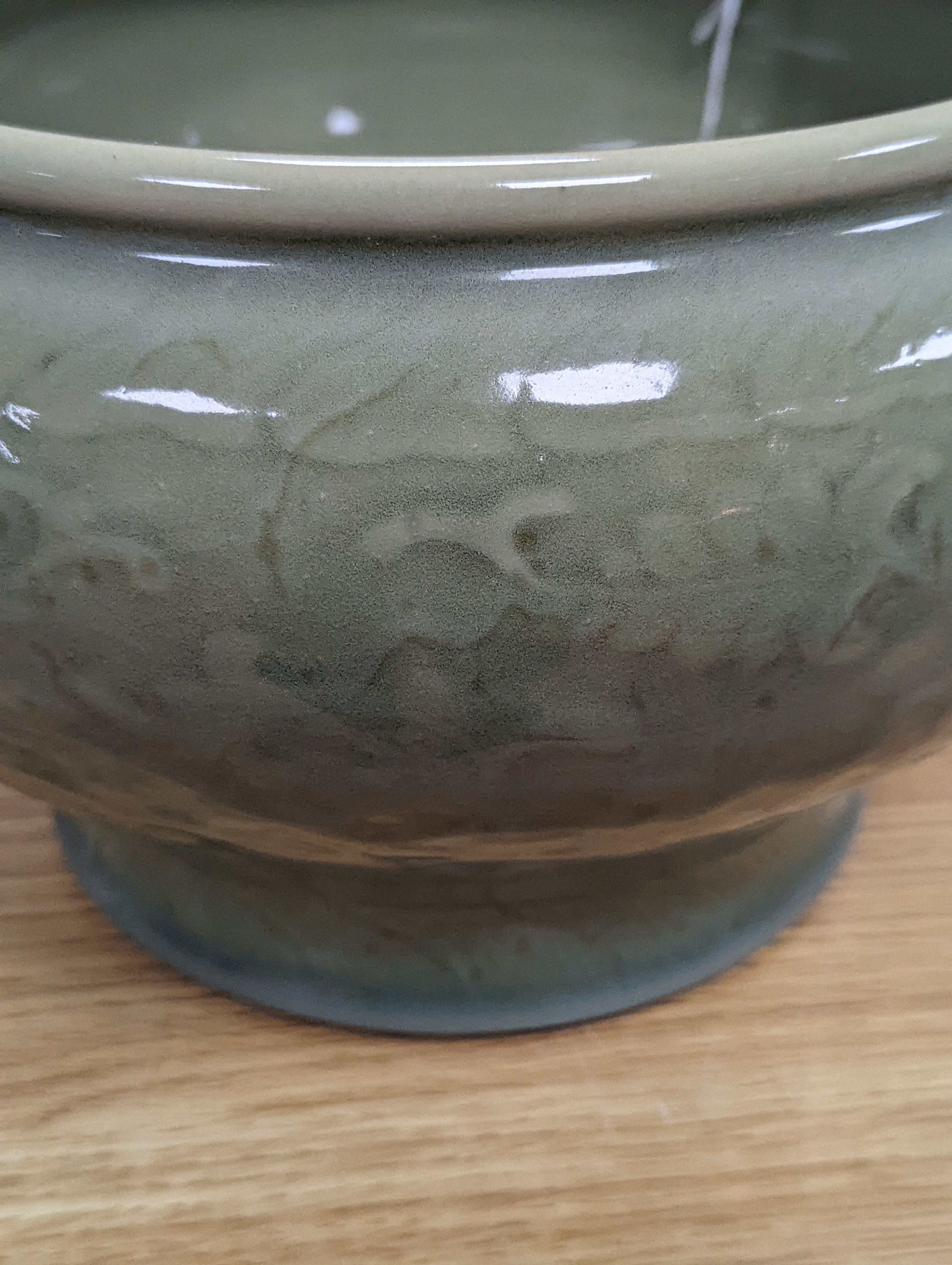 A Chinese celadon glazed bowl - 17.5cm tall